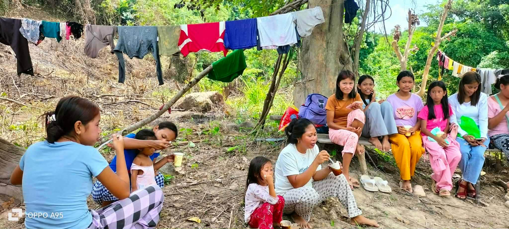 Conversation and food preparation during a community gathering